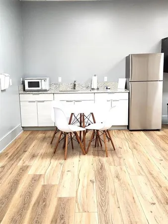 a white refrigerator freezer sitting in a kitchen