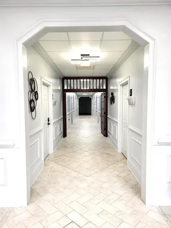 a view of a hallway with a window