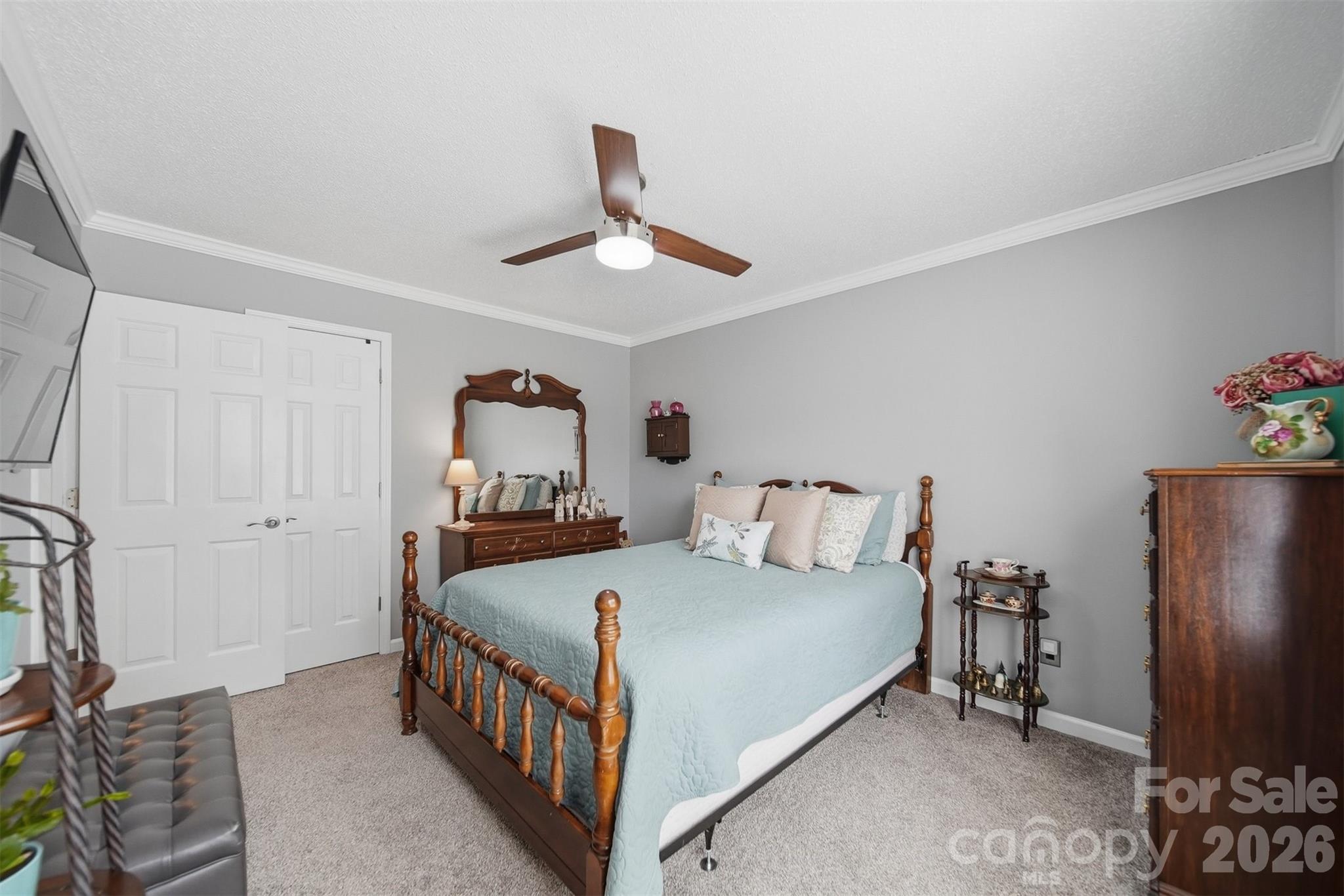 2104 Sheffield Court Northwest Conover, NC 28613 - Photo 15 of 25 a bedroom with a bed and a chandelier