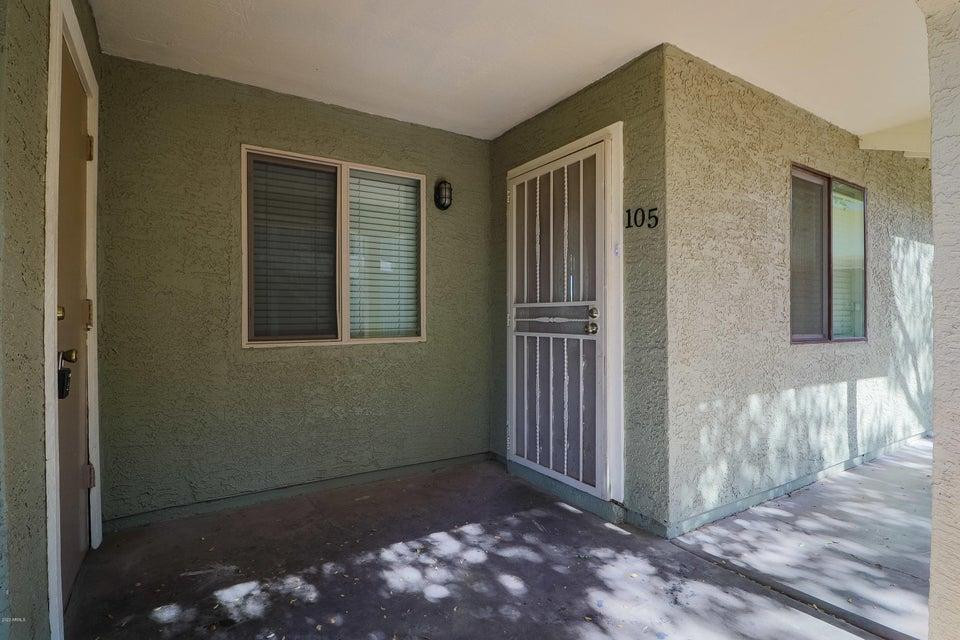 1336 East Mountain View Road, Unit 105 Phoenix, AZ 85020 - Photo 2 of 15 a view of a house with a door and wooden floor