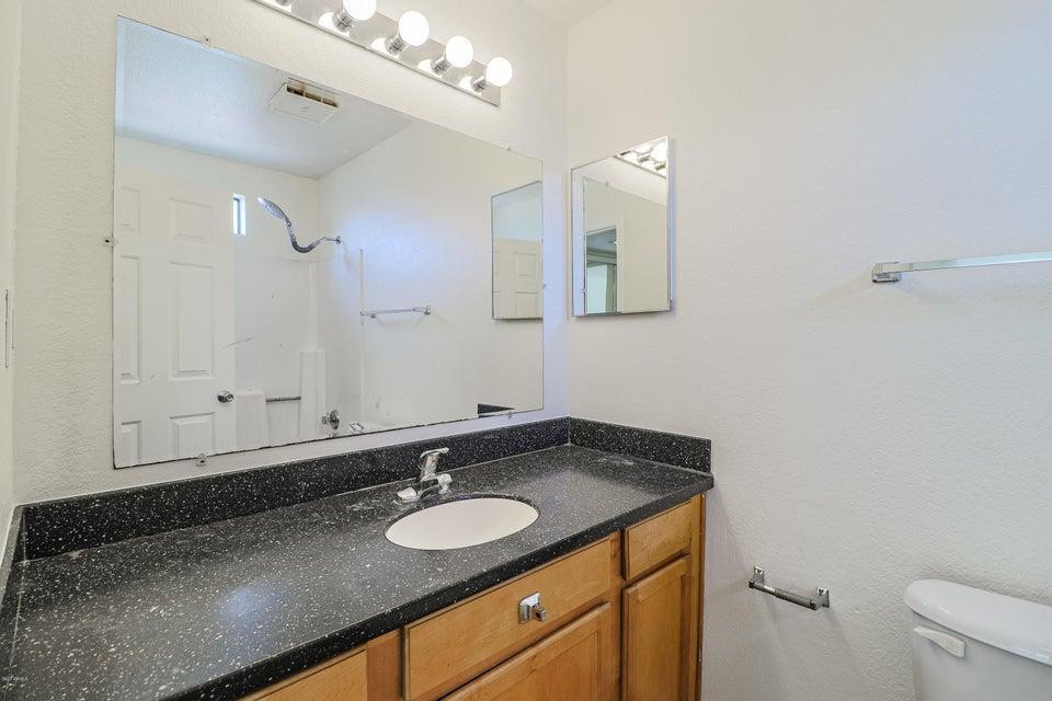 1336 East Mountain View Road, Unit 105 Phoenix, AZ 85020 - Photo 9 of 15 a bathroom with a sink and a mirror