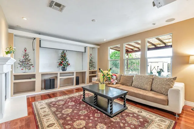 a living room with furniture and a rug