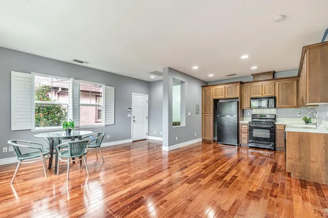 a spacious bedroom with a bed and a ceiling fan