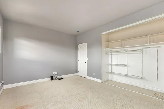 a view of an empty walk in closet