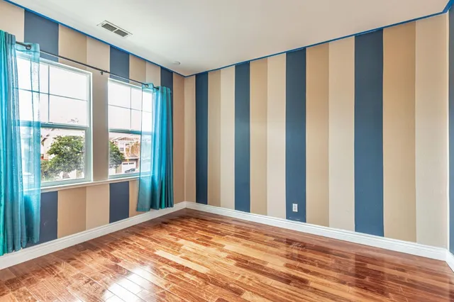 a spacious bathroom with a tub sink shower and mirror