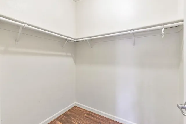 a white toilet sitting next to a shower