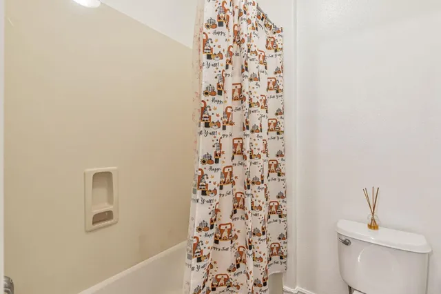 a view of living room with patio furniture and a view of the patio