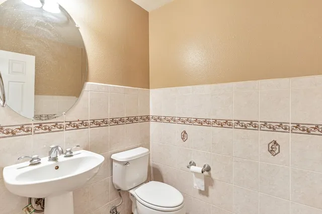 a backyard of a house with table and chairs