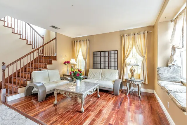 a living room with furniture and a table