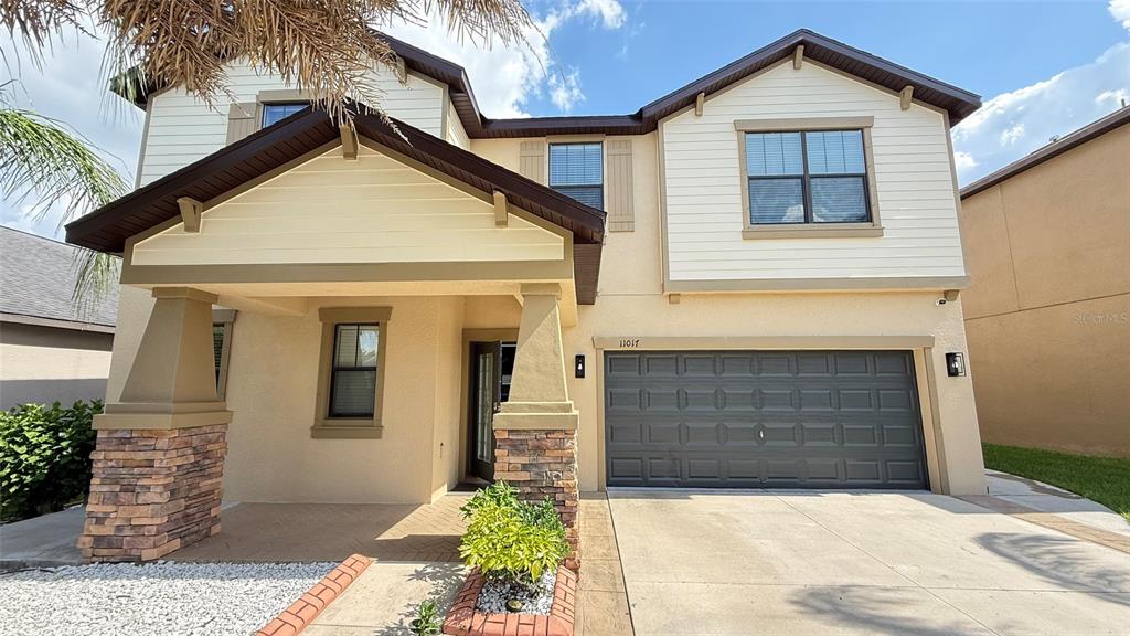 11017 Purple Martin Boulevard Riverview, FL 33579 - Photo 2 of 46 a front view of a house with a yard