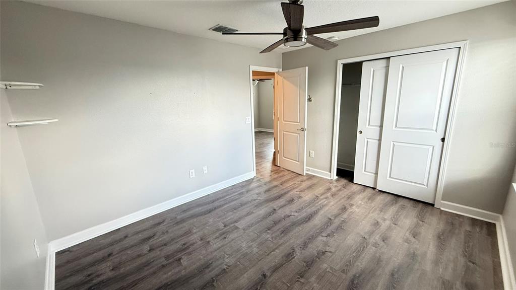11017 Purple Martin Boulevard Riverview, FL 33579 - Photo 28 of 46 wooden floor in an empty room