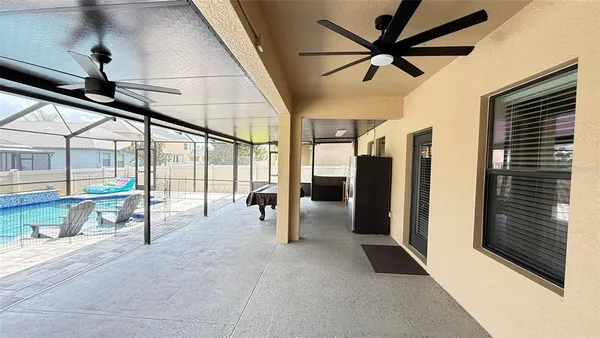 a view of a chairs and table in the patio