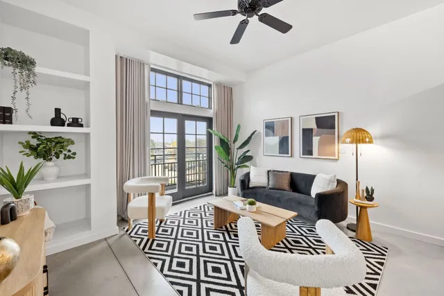 a living room with furniture and a window