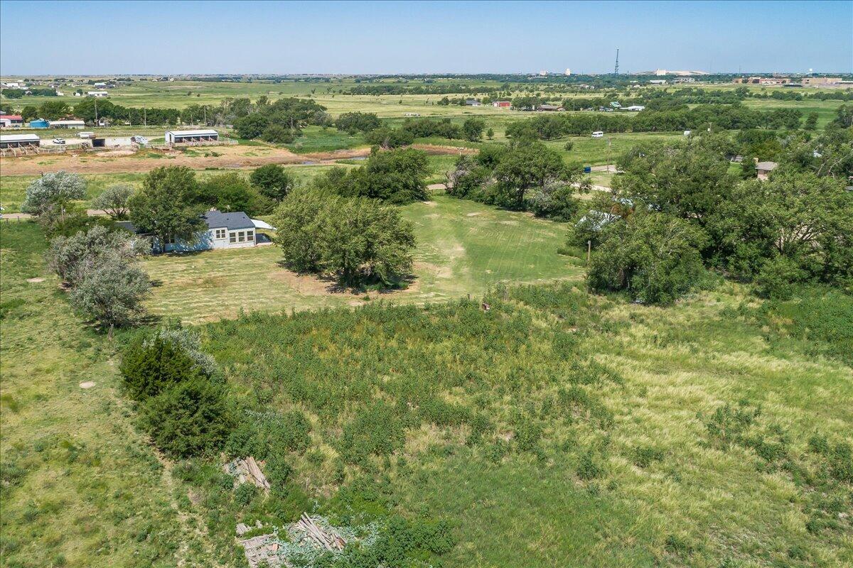 25701 Newton Road Canyon, TX 79015 - Photo 27 of 30 an aerial view of residential houses with outdoor space and trees