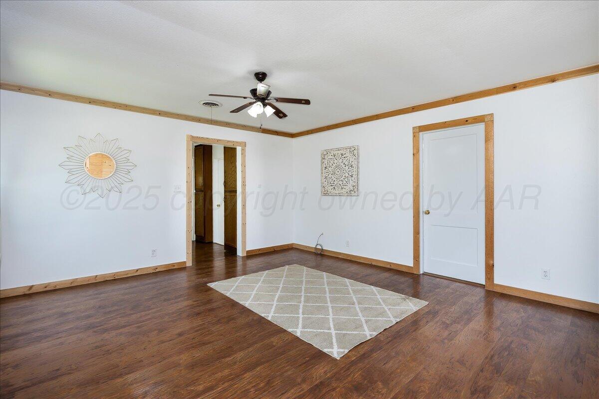 25701 Newton Road Canyon, TX 79015 - Photo 30 of 30 a view of an empty room with wooden floor