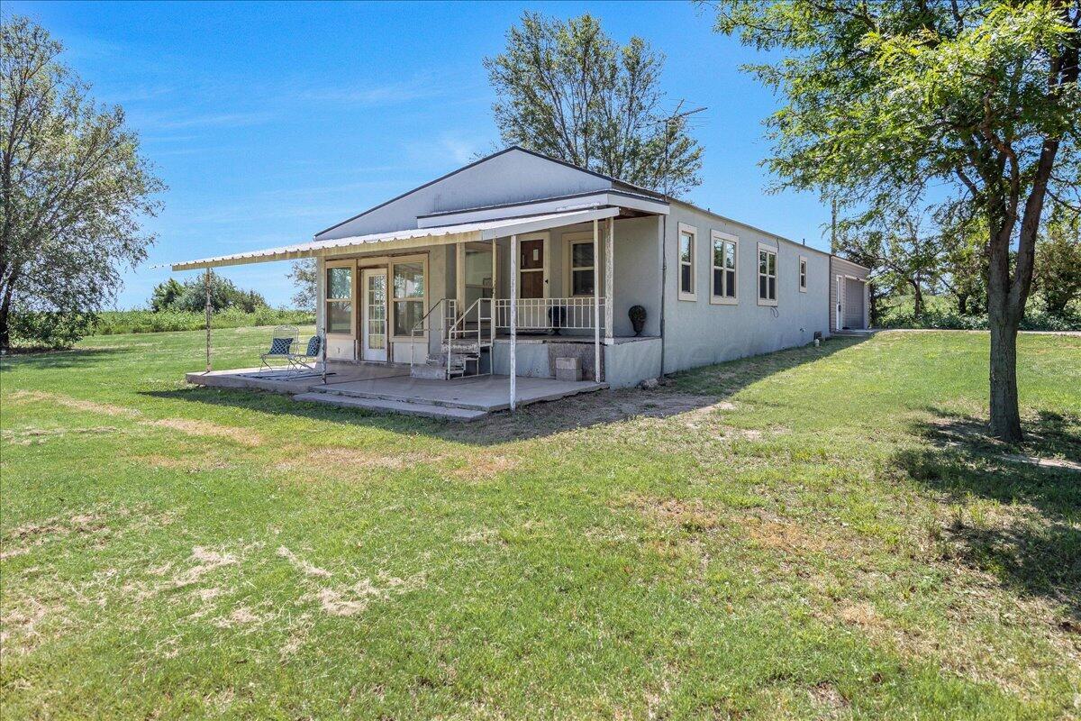 25701 Newton Road Canyon, TX 79015 - Photo 3 of 30 a front view of a house with a garden and porch