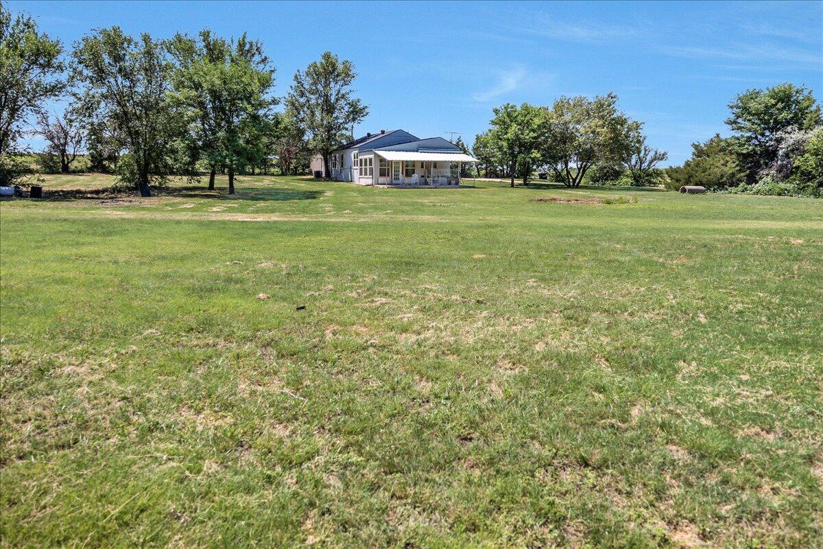 25701 Newton Road Canyon, TX 79015 - Photo 5 of 30 a front view of a house with a yard and trees
