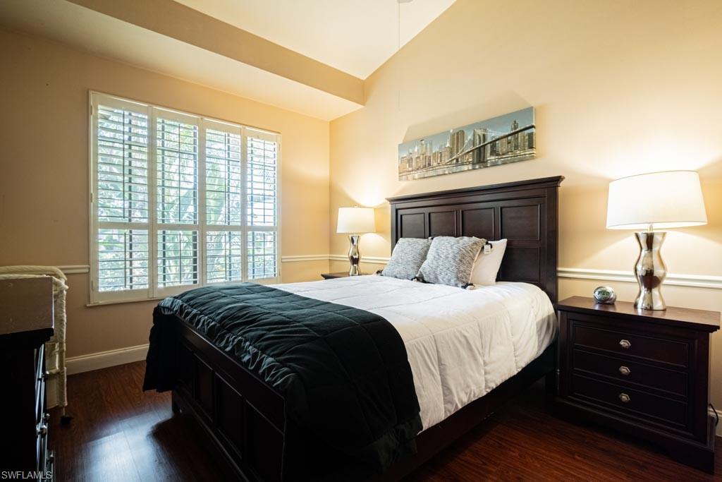 2209 Pinewoods Circle Naples, FL 34105 - Photo 27 of 46 a bedroom with a bed and a window