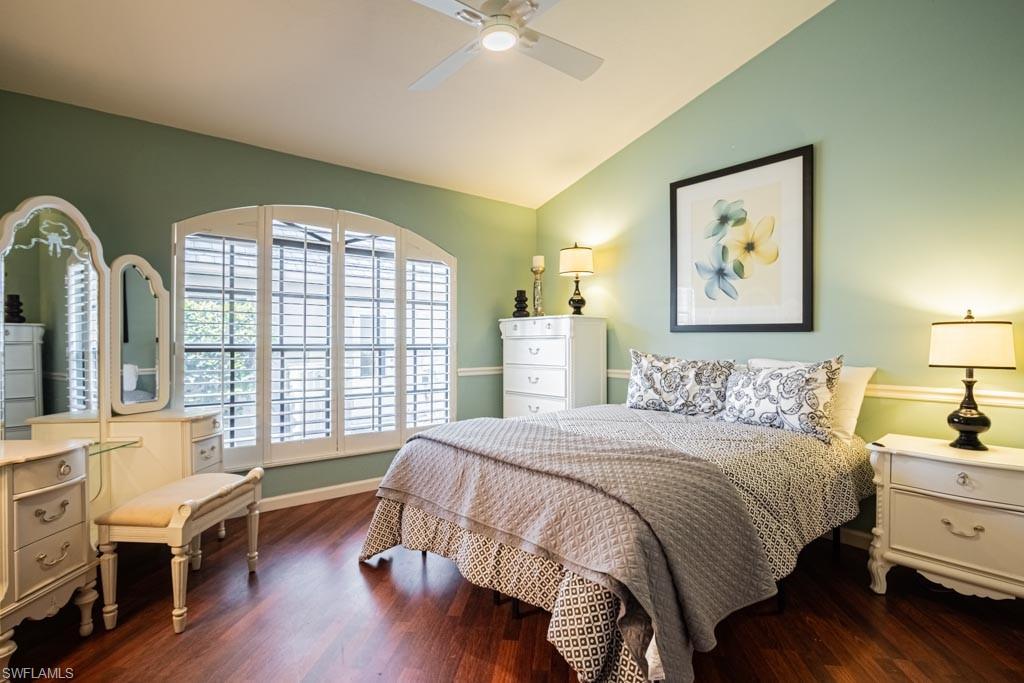 2209 Pinewoods Circle Naples, FL 34105 - Photo 29 of 46 a bedroom with a bed and a large window