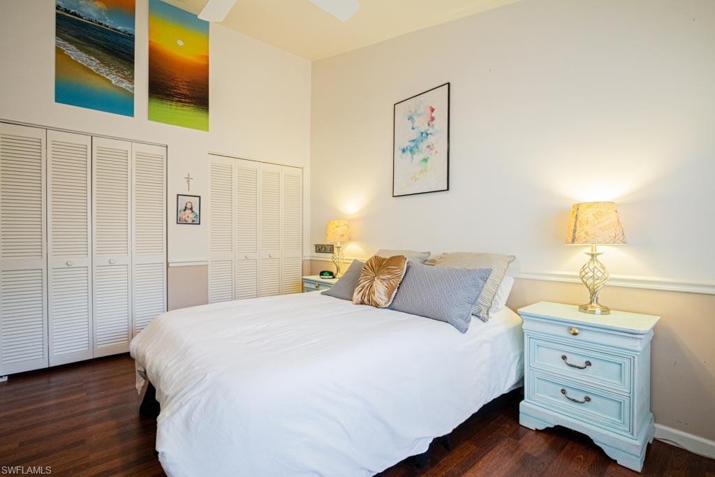 2209 Pinewoods Circle Naples, FL 34105 - Photo 32 of 46 a bedroom with a bed and a night stand