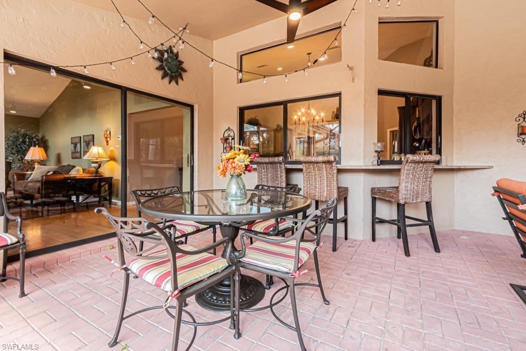 2209 Pinewoods Circle Naples, FL 34105 - Photo 36 of 46 a view of a dining room with furniture window and outside view