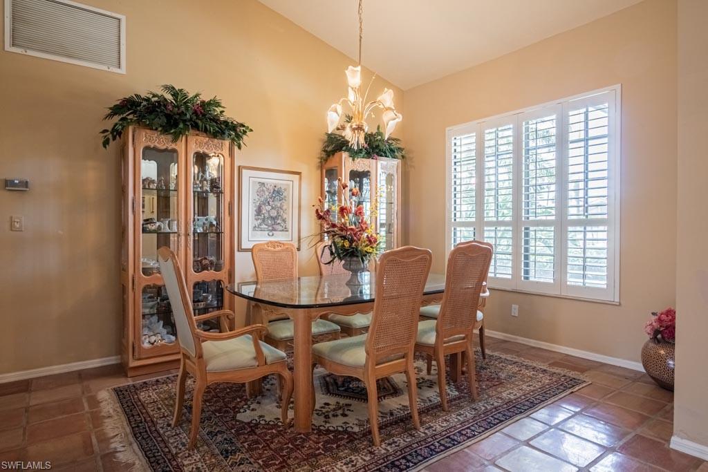 2209 Pinewoods Circle Naples, FL 34105 - Photo 4 of 46 a view of a dining room with furniture window and outside view
