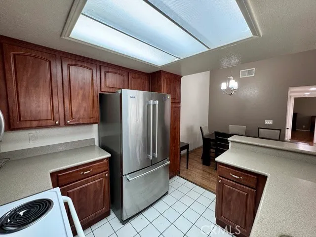 a kitchen with a refrigerator and a sink