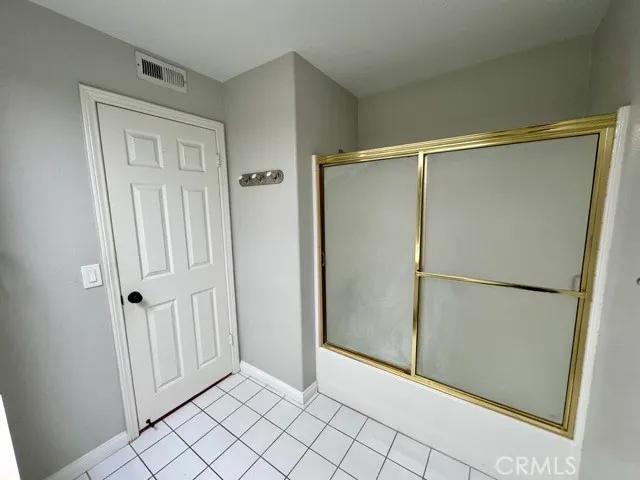 an empty room with wooden floor