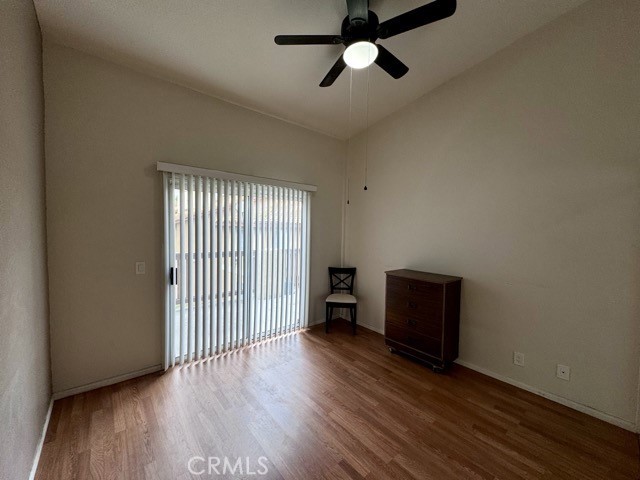 42140 Lyndie Lane, Unit 24 Temecula, CA 92591 - Photo 19 of 35 an empty room with wooden floor and windows
