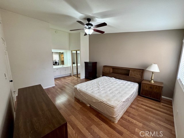 42140 Lyndie Lane, Unit 24 Temecula, CA 92591 - Photo 22 of 35 a bedroom with a bed and a dresser