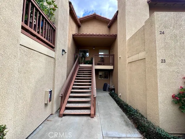 a view of a hallway with stairs