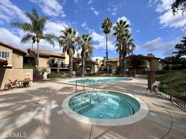 42140 Lyndie Lane, Unit 24 Temecula, CA 92591 - Photo 33 of 35 a swimming pool with outdoor seating and yard