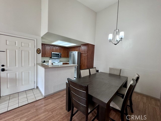 42140 Lyndie Lane, Unit 24 Temecula, CA 92591 - Photo 8 of 35 a view of a dining room with furniture and wooden floor