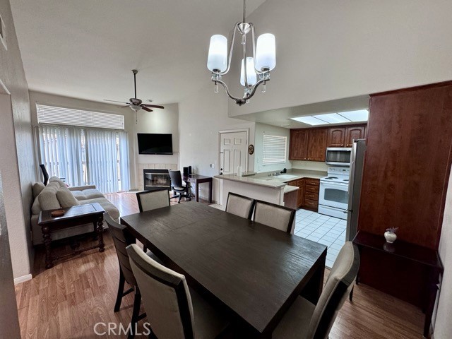 42140 Lyndie Lane, Unit 24 Temecula, CA 92591 - Photo 9 of 35 a view of a dining room with furniture and wooden floor