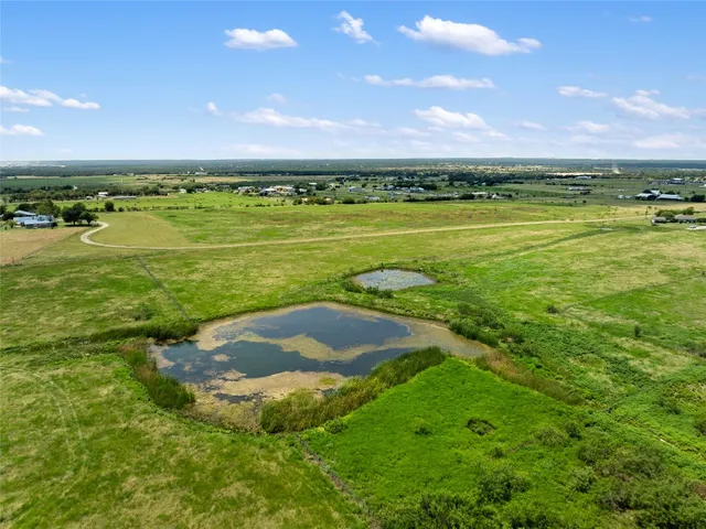 a view of a golf course with a lake