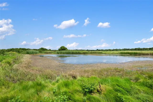 a view of lake with green space