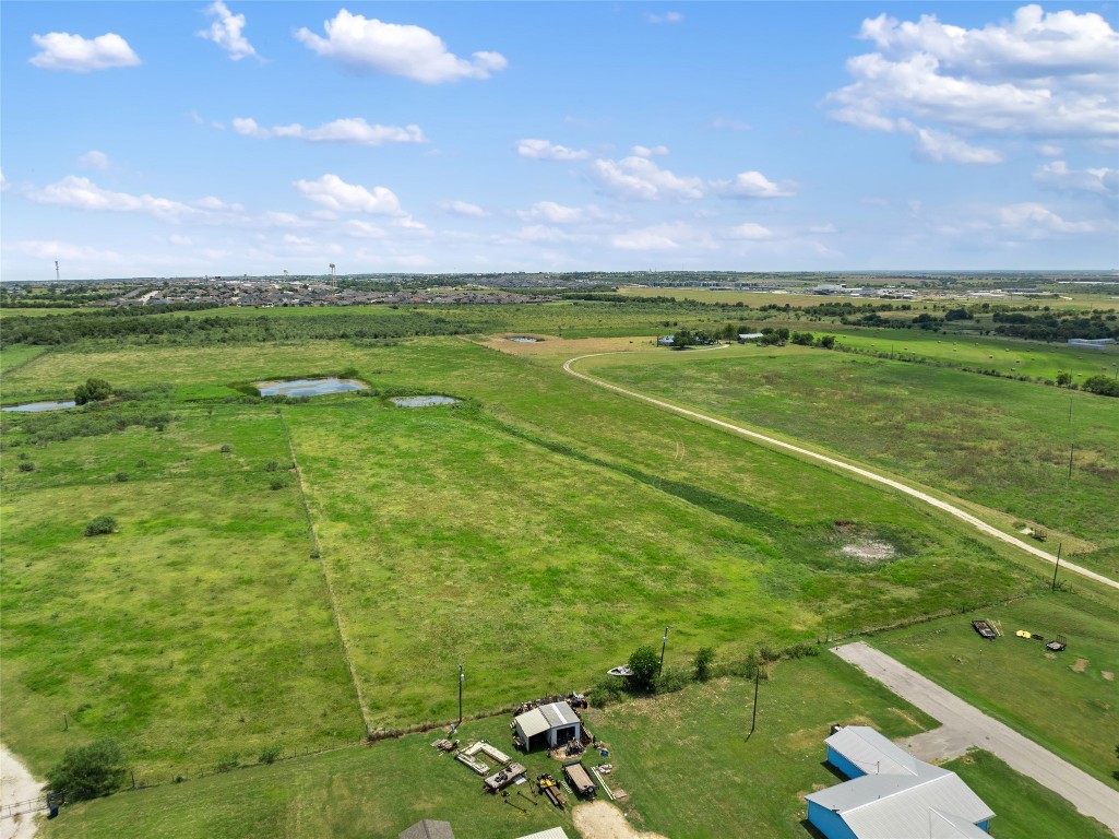 1775 County Road 305 Jarrell, TX 76537 - Photo 10 of 11 a view of a golf course with a lake