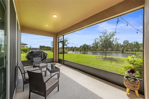a view of living room with furniture and wooden floor