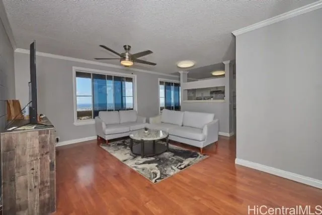 a living room with fireplace furniture and a wooden floor