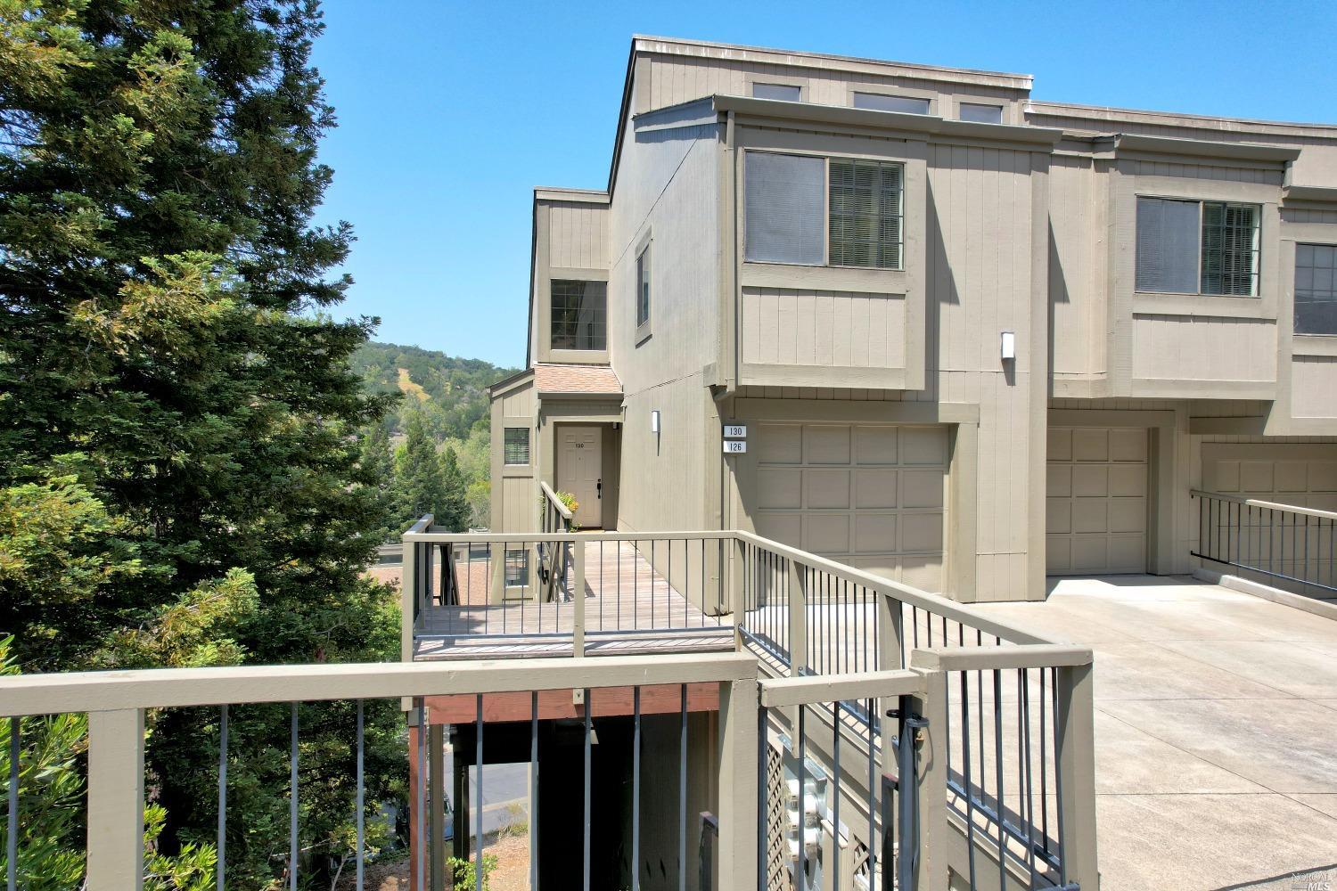 a view of a house with a small yard