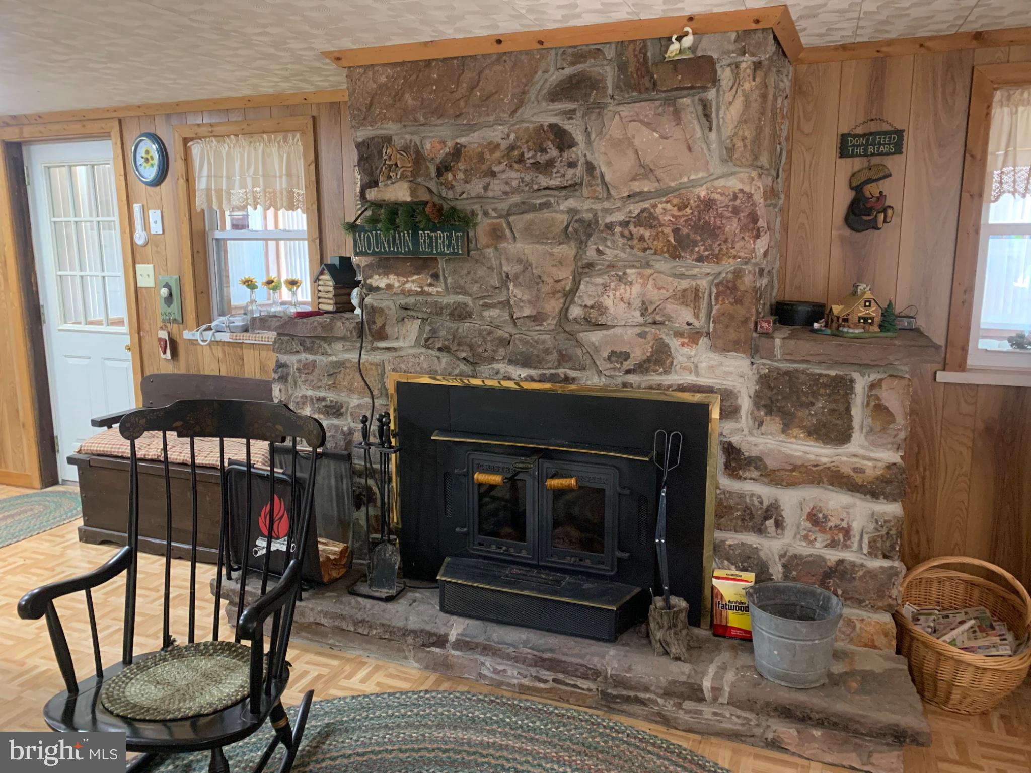 5547 Fox Road Fort Loudon, PA 17224 - Photo 17 of 27 Cozy stone fireplace in rustic retreat.