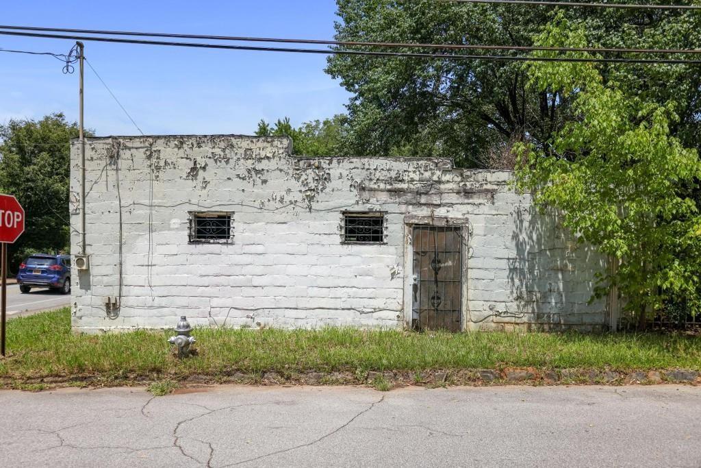 1917 Defoor Avenue Northwest Atlanta, GA 30318 - Photo 20 of 35 a view of a brick house next to a yard