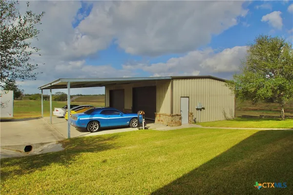 a blue swimming pool is in front of a building