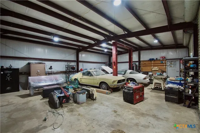 a utility room with lots of furniture and clutter
