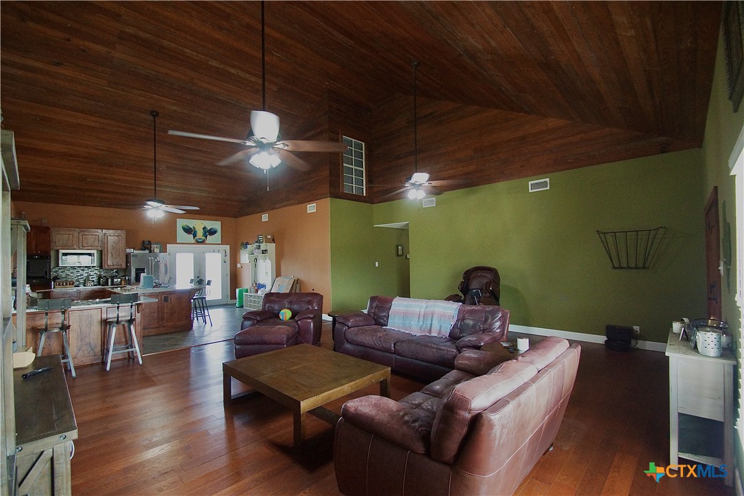 27 Stehle Road Victoria, TX 77905 - Photo 21 of 34 a living room with furniture and a chandelier