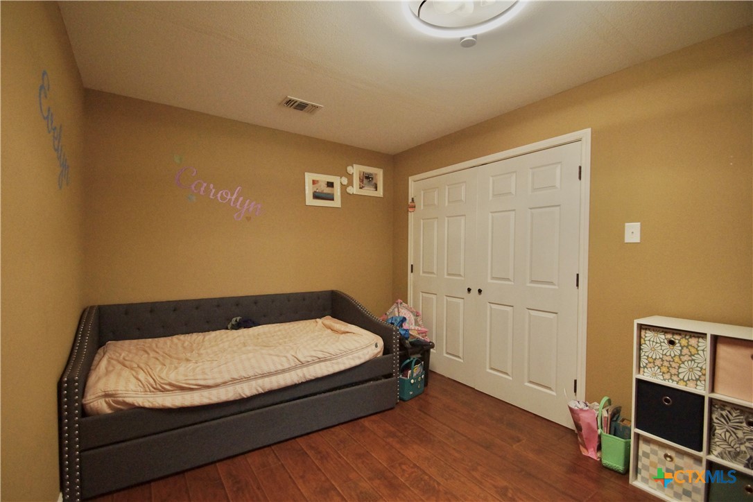 27 Stehle Road Victoria, TX 77905 - Photo 29 of 34 a room with a bed and flat screen tv