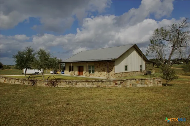 a view of house with outdoor space and swimming pool