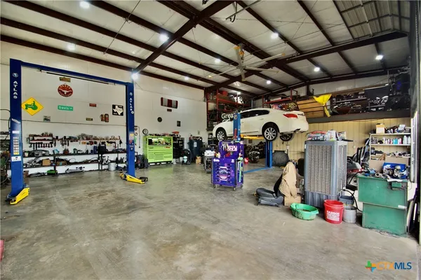 a view of a garage with rack and bicycle