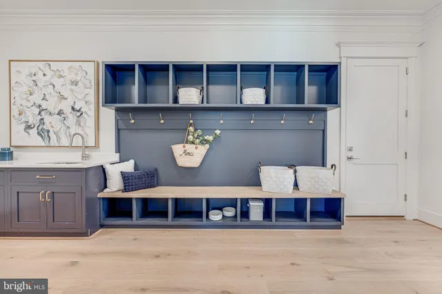 a view of kitchen and wooden cabinets
