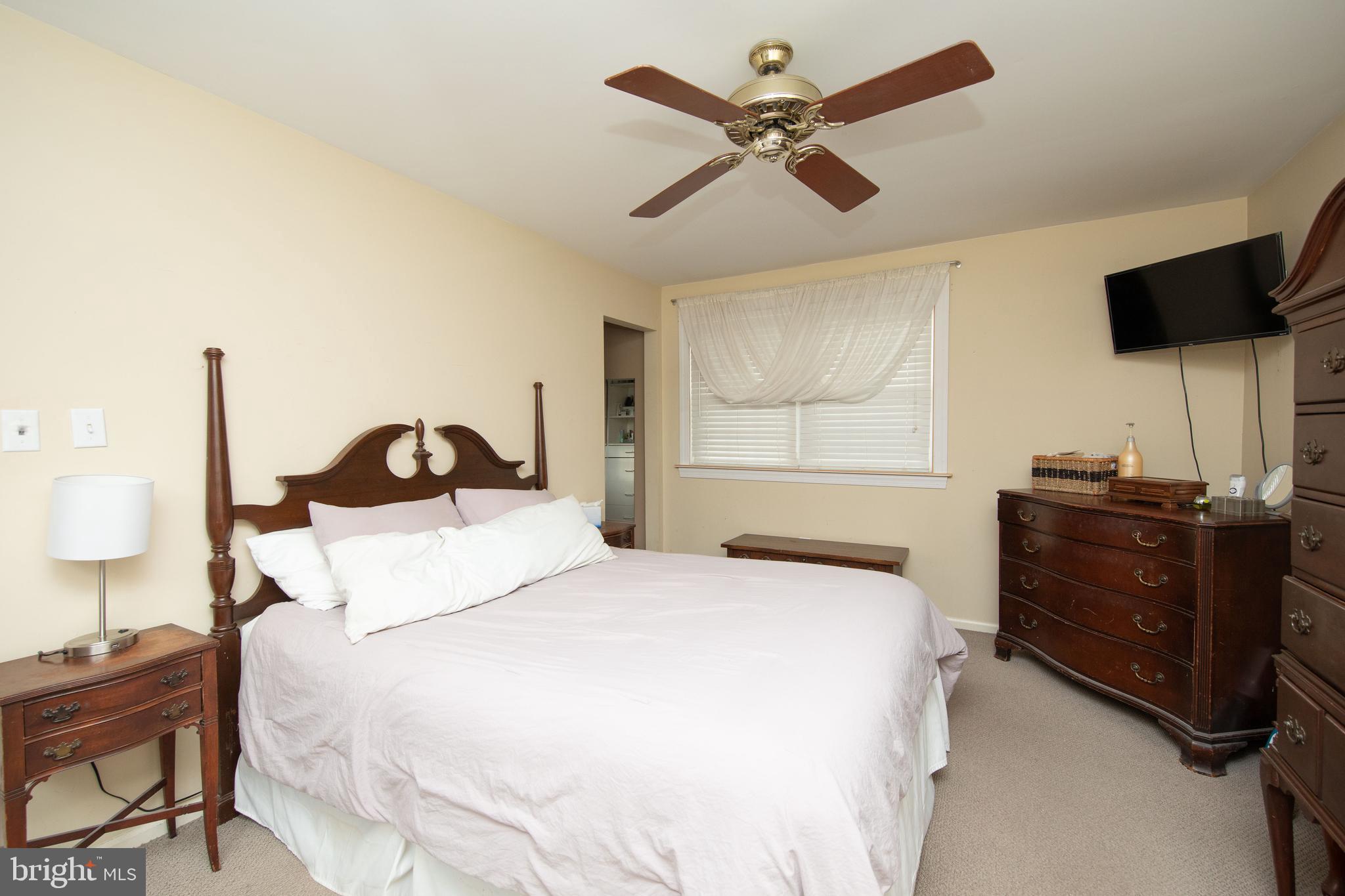 2086 Fort Bevon Road Harleysville, PA 19438 - Photo 18 of 24 a bedroom with a bed and a flat tv screen on dresser